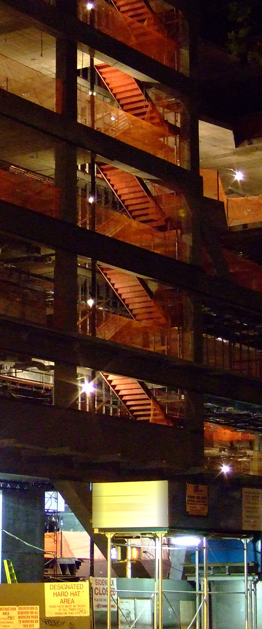 [scene 9 anatomy]<br />
			steel skeleton of an abandoned building<br />
			illuminated from within,is so neatly framed<br />
			in <span class="enlarge">orthagonal</span> perspective